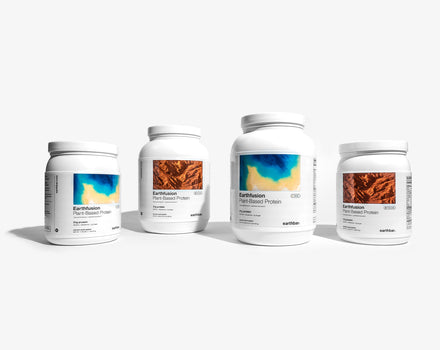 A collection of four jars of Earthbar protein powder supplements, with labels showing different flavors such as 'Chocolate', 'Vanilla'