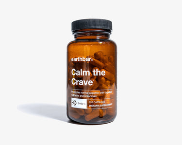 A bottle of 'Calm the Crave' supplement capsules by Earthbar, with a label that includes the product name and the tag 'function tags_weightloss'.