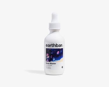 A bottle of Earthbar Sinus Blaster herbal tonic with a dropper cap.