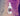 A bottle of 'earthbar Slim Down' herbal tonic with a dropper cap, predominantly white label with purple and pink speckles and text.