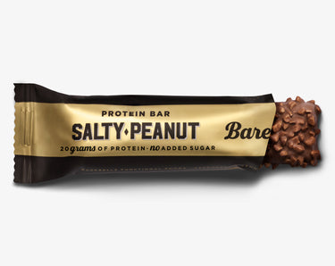 A packaged Salty Peanut flavored protein bar by Barebells, with an image of the bar's texture showing peanuts on the top.