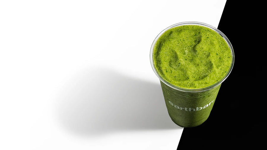 Green smoothie in a clear cup with 'northbar' branding on a white background