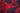 Red triangle patch on a red and black camouflage fabric with water droplets.