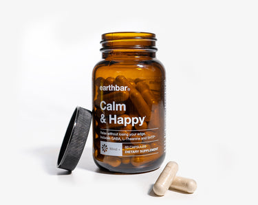 A jar of Earthbar Calm & Happy supplement.