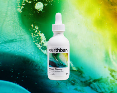 Earthbar Energy Ginseng supplement, 2 fl oz bottle, front label on abstract green background