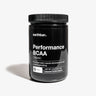 A black jar of earthbar Performance BCAA powder in orange flavor.