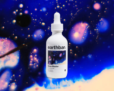 Earthbar sinus blaster supplement, 2 fl oz bottle, front label on abstract blue background